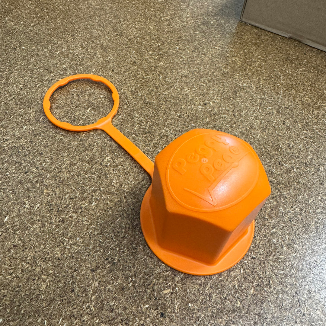 Was ist diese orangene Kappe in meinem Paket?